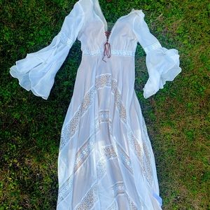 Waters size 10, needs dry cleaning but no damage